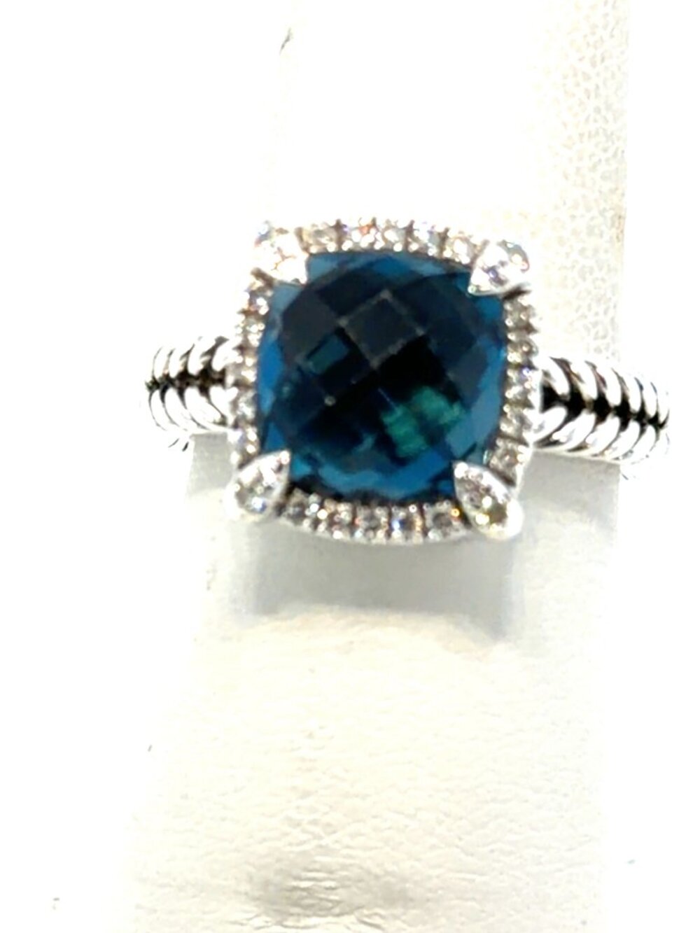 Silver diamond and blue topaz ring